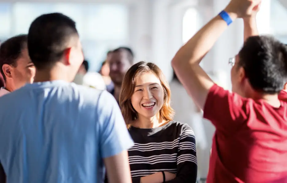 A group of Viking employees conversing at a social event